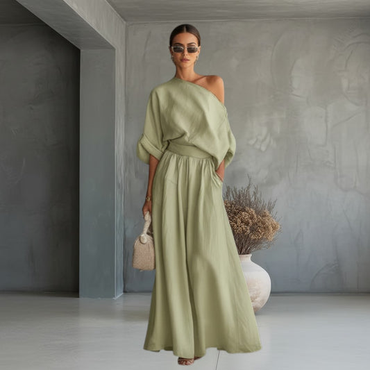 Mujer vistiendo conjunto vestismuse de dos piezas verde oliva con top de hombro descubierto y pantalón de corte amplio