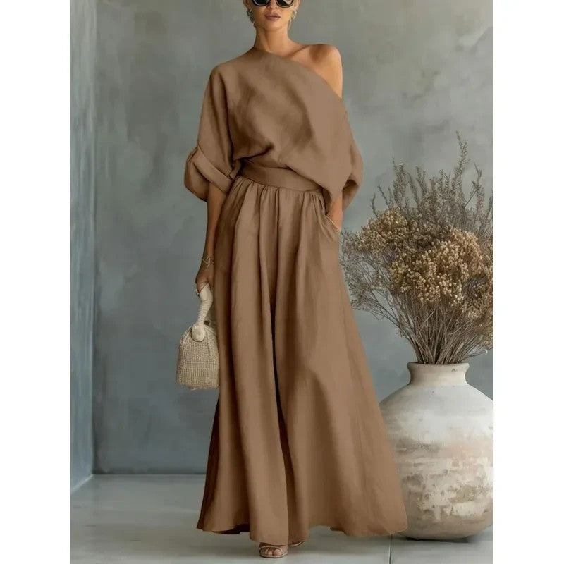 Conjunto vestismuse de dos piezas en color marrón, top de hombro descubierto y pantalón amplio de poliéster fluido