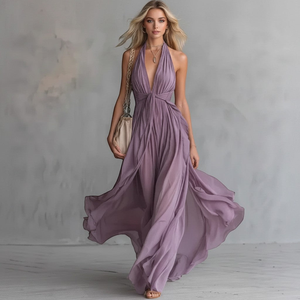 Modelo rubia con vestido largo morado vestismuse de escote halter, cintura alta y falda fluida de poliéster.